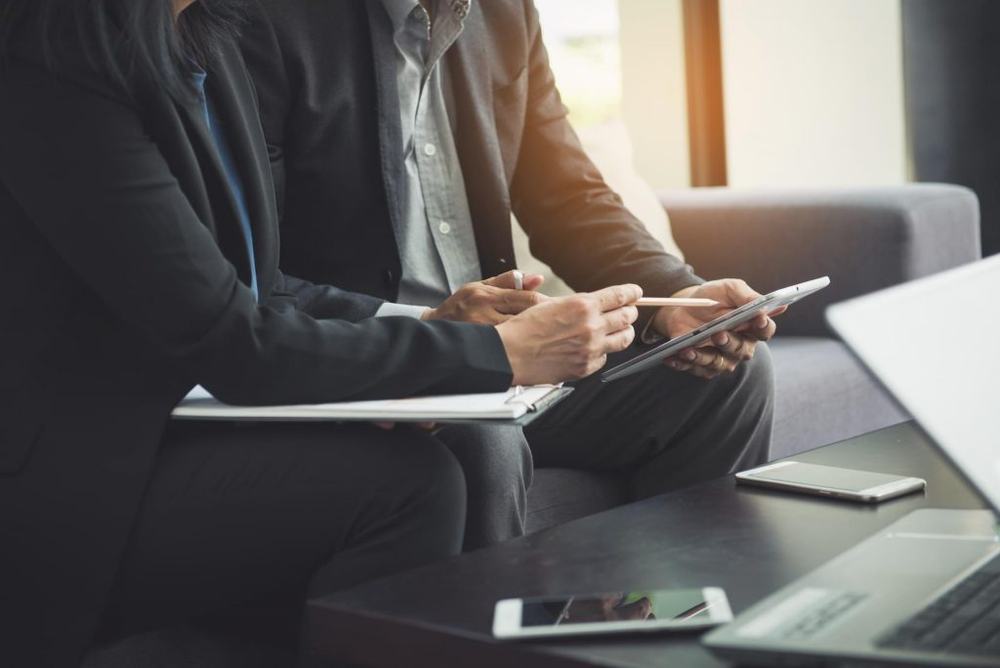 Business colleagues reviewing a tablet together